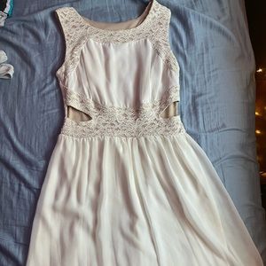 white patterned dress with cut outs on the side!